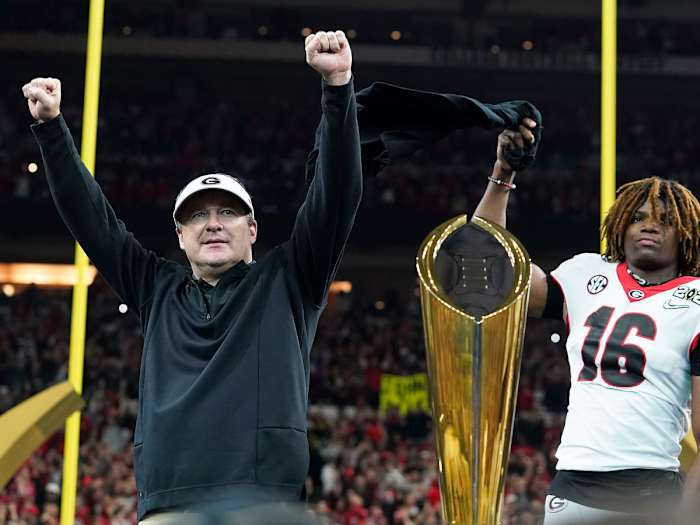 Kirby Smart lifts his arms after Georgia's title